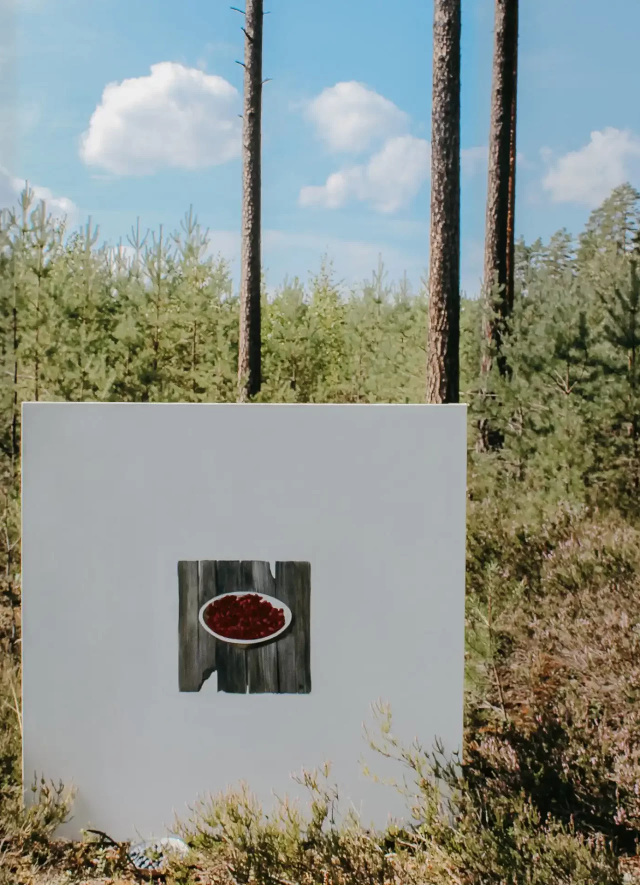 painting of bowl of strawberries in woods